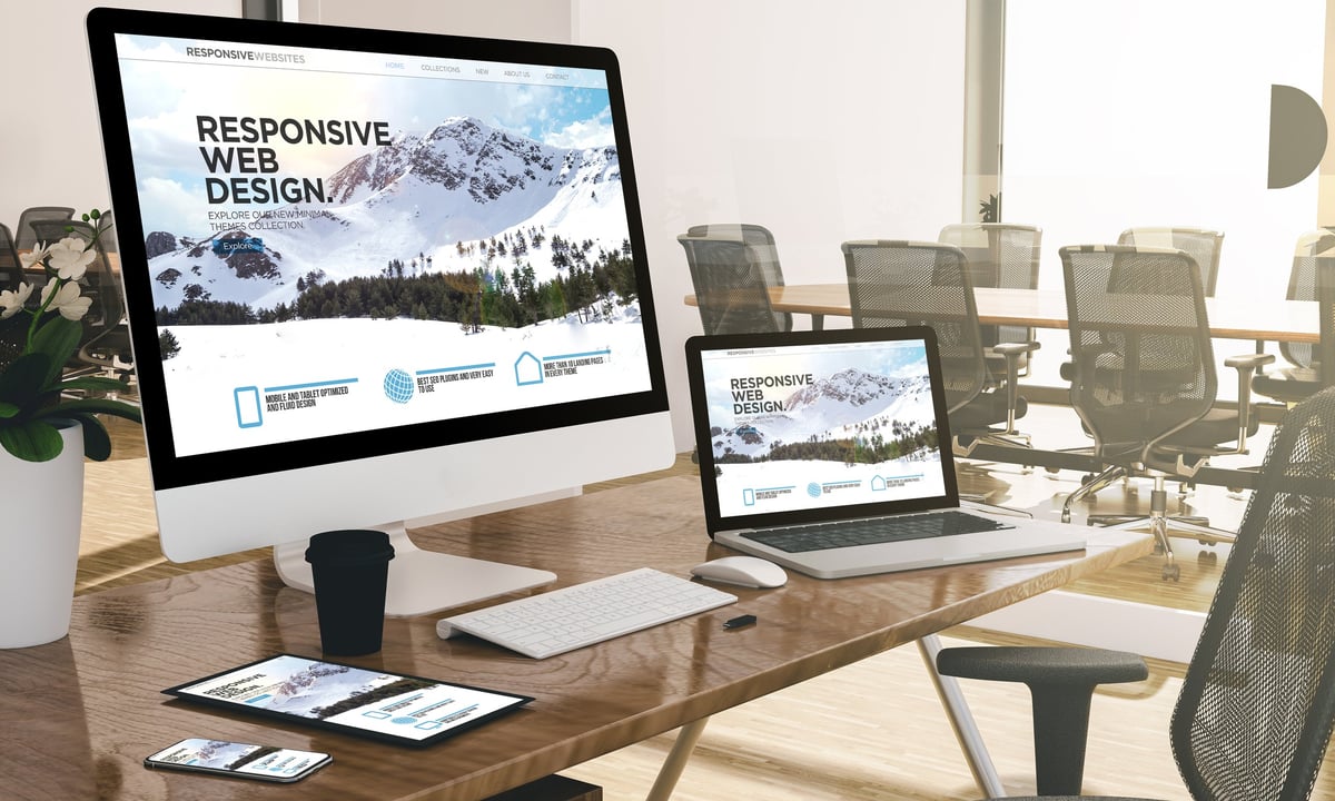 Modern responsive web design showing devices at office